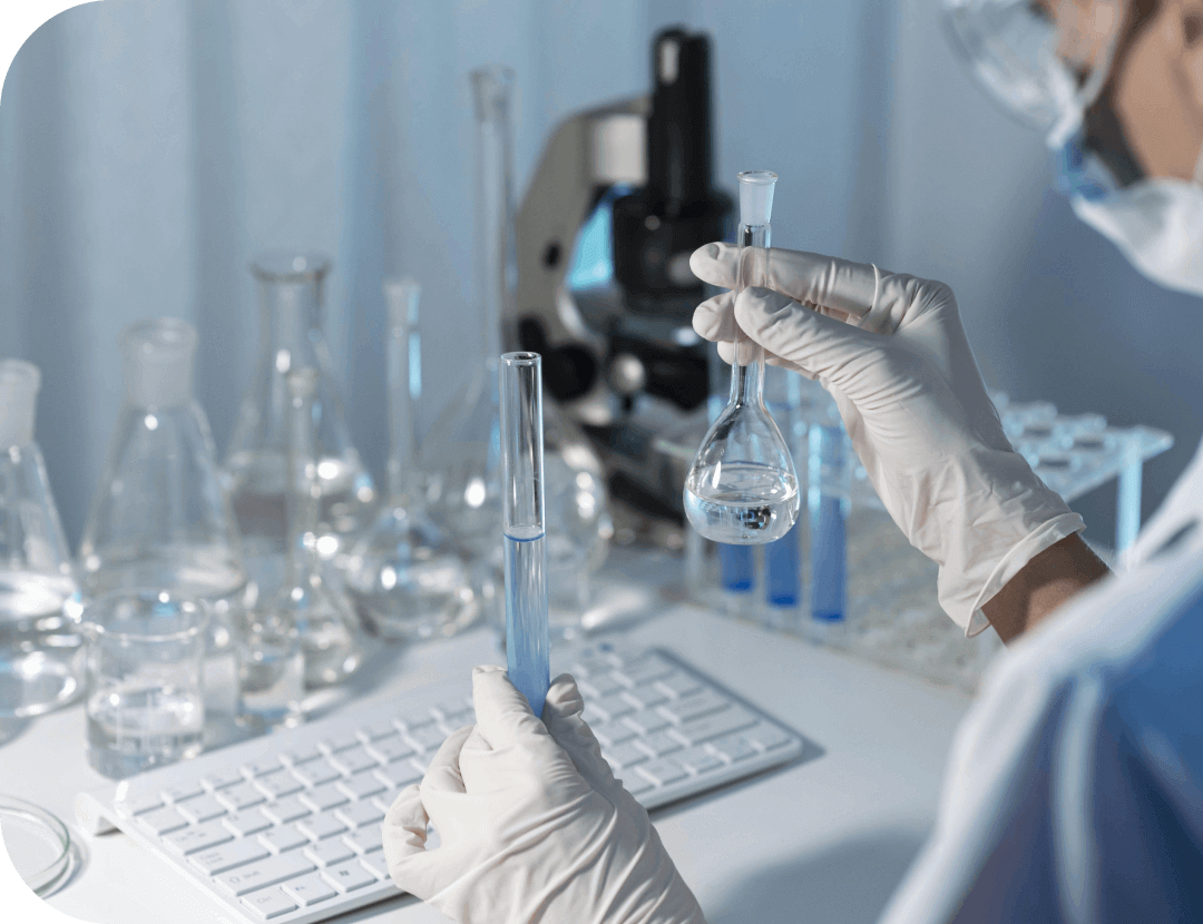 close up researcher holding glassware 1